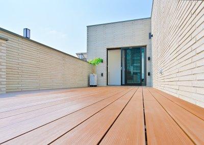 Durable artificial wooden rooftop deck installation