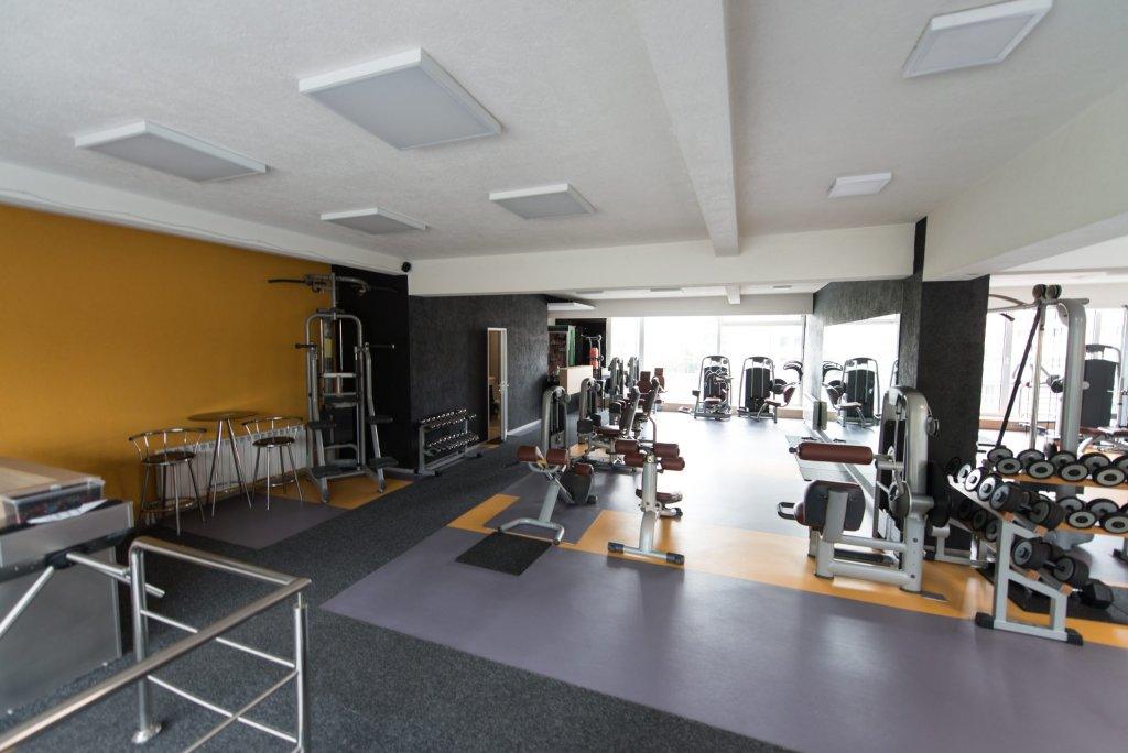 Empty gym interior with fitness equipment