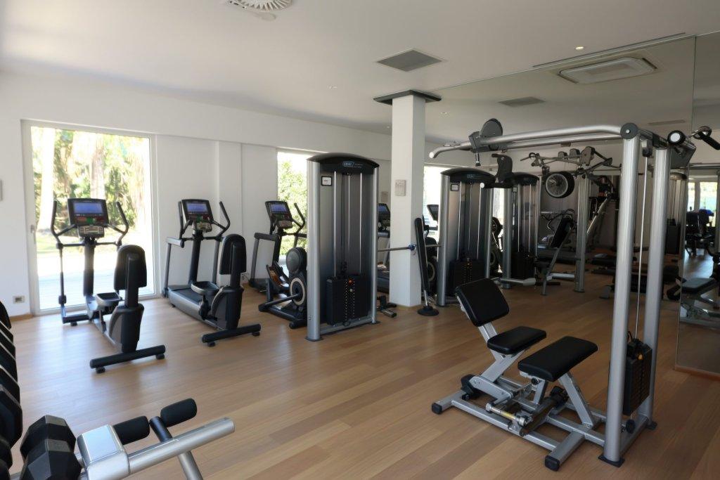 Modern gym interior with workout machines and cardio equipment