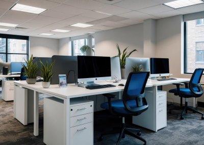 Modern office space with ergonomic desks and computers