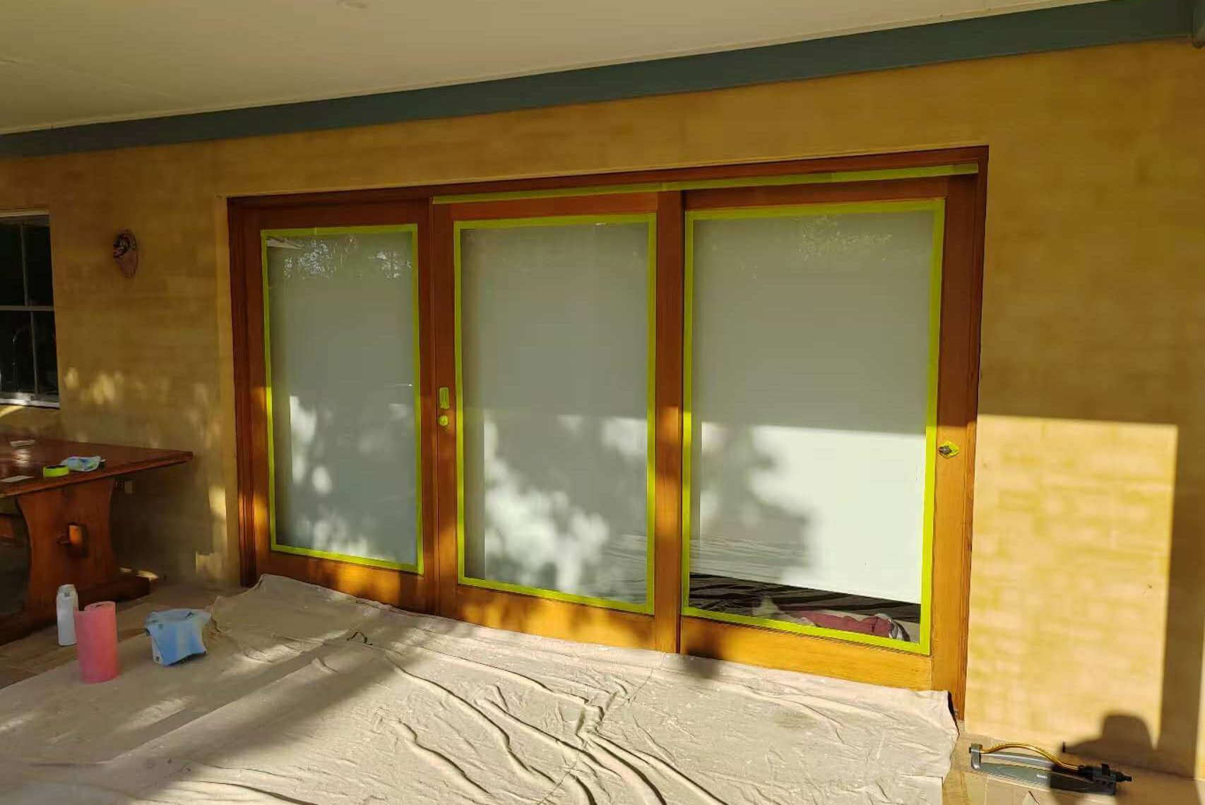 Sunlit patio doors with floor protection in place