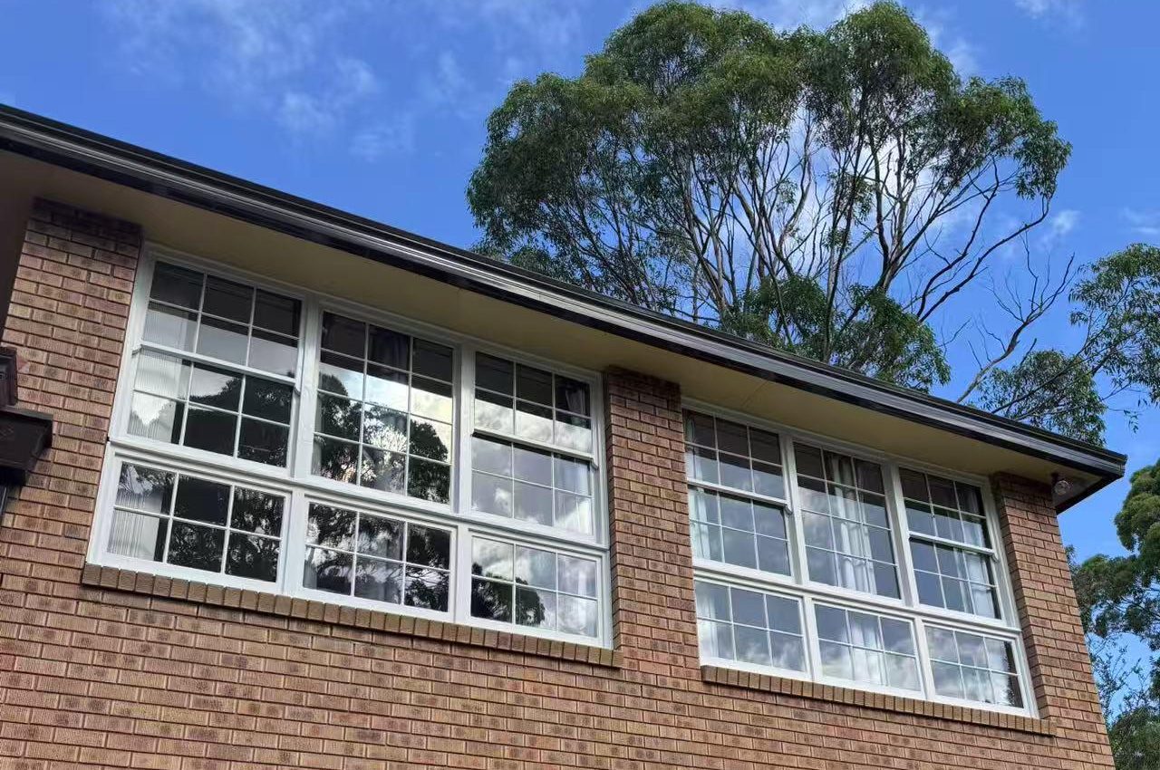Exterior walls and windows prepared for painting